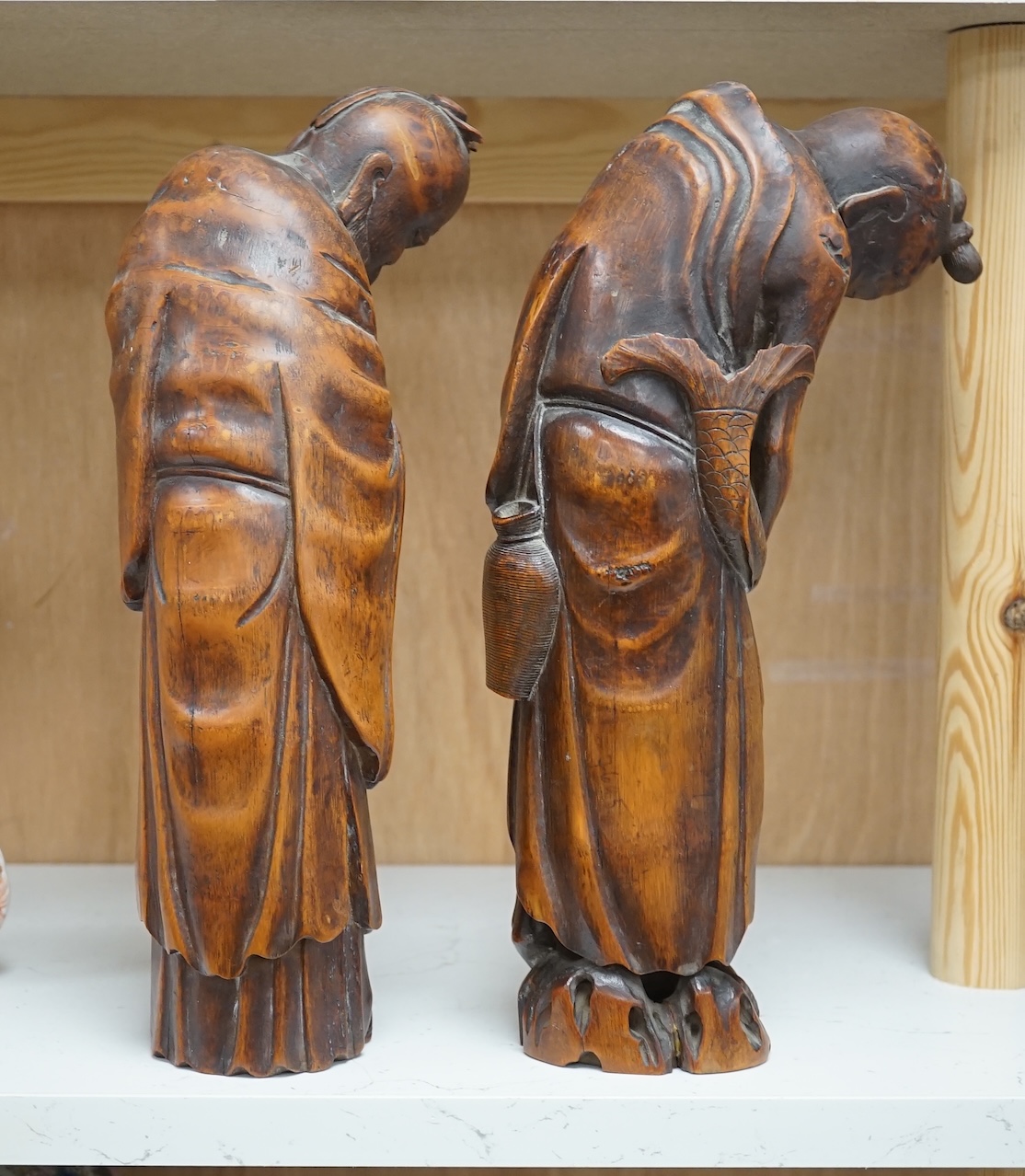 Two 19th century Chinese bamboo root figures of a fisherman and Shou Lao, tallest 32cm. Condition - fair to good